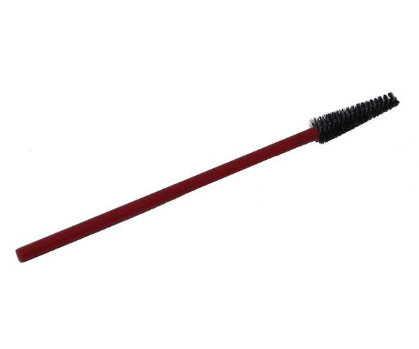 Red eyelash brush with black bristles on a white background