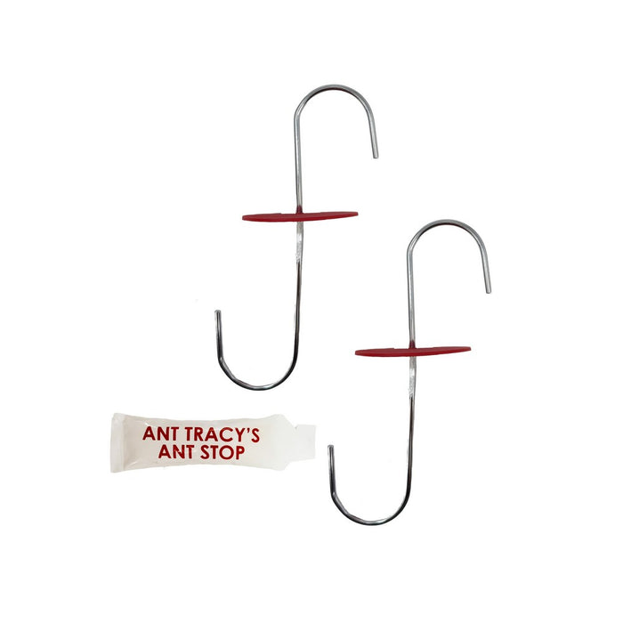 Two metal hooks with a tube of 'ANT TRACY'S ANT STOP' on a white background