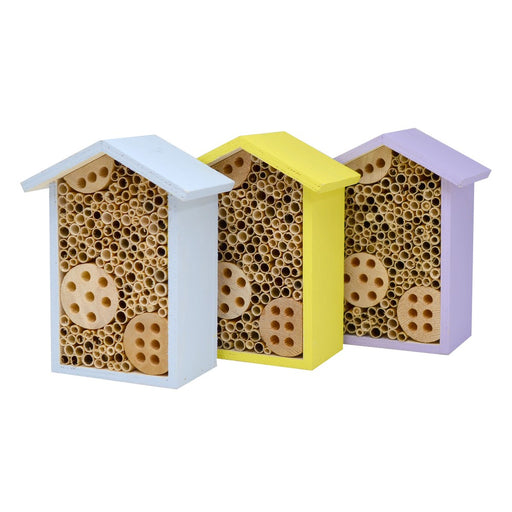 Three bee hotels in white, yellow, and purple on a white background