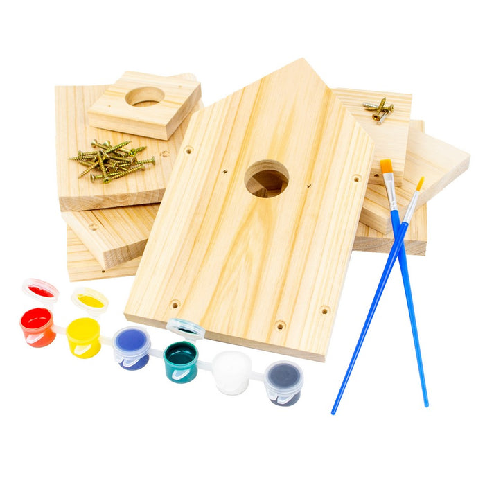 Wooden birdhouses with paint cans and brushes on a white background