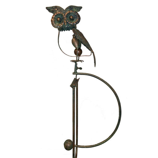 Decorative metal owl on a white background