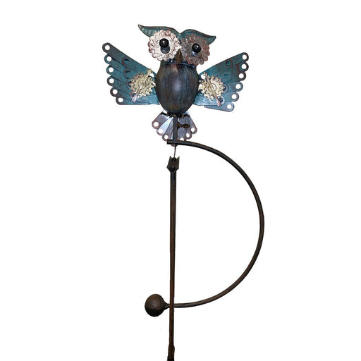 Decorative metal owl on a white background