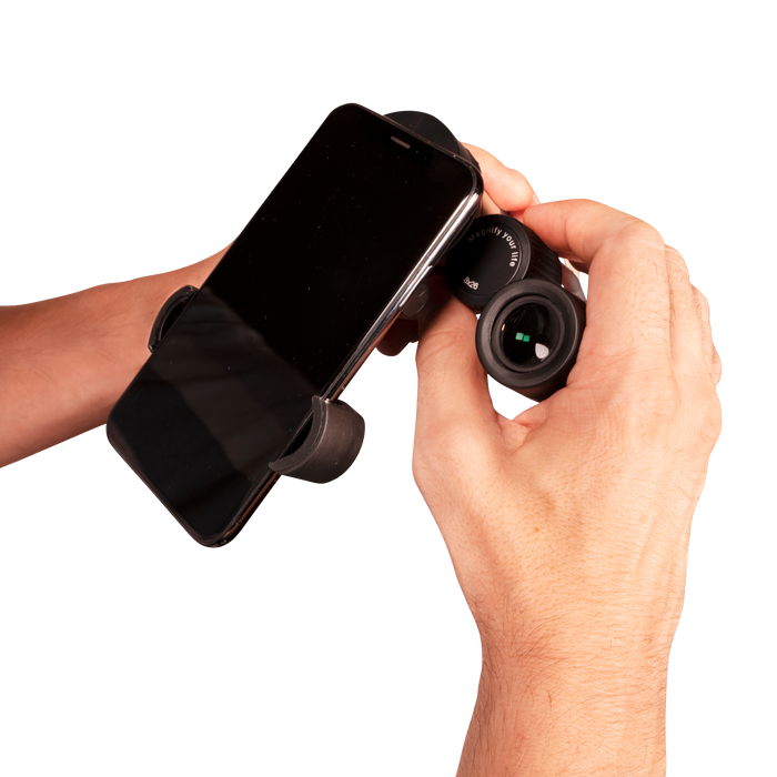 Hand holding a smartphone with a black phone holder against a white background