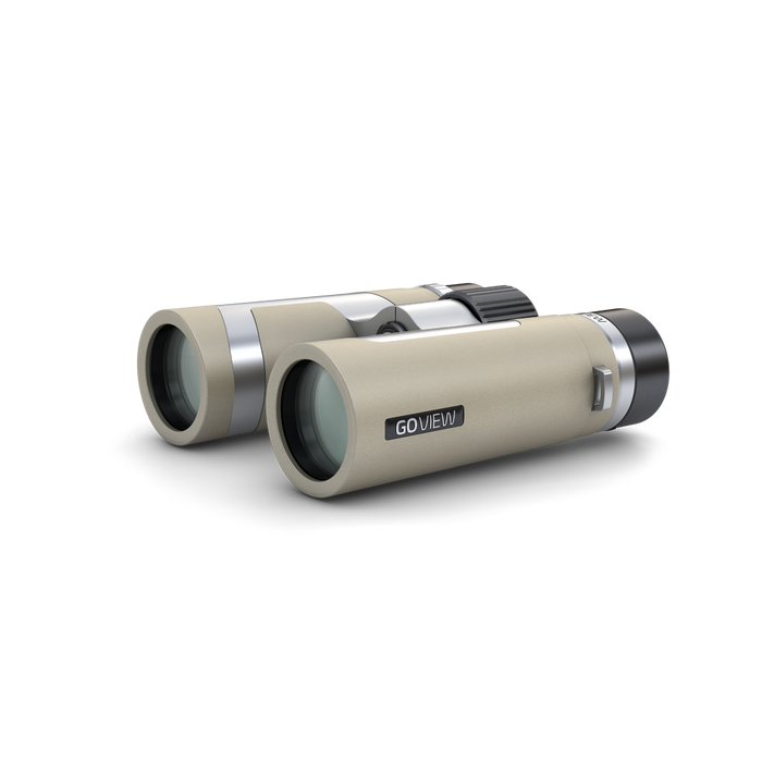 Beige binoculars with silver accents on a white background
