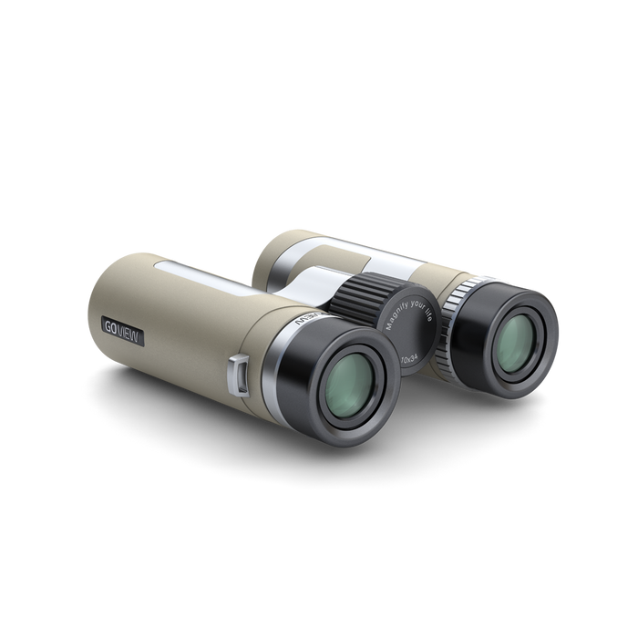 Binoculars with a beige and silver design on a white background