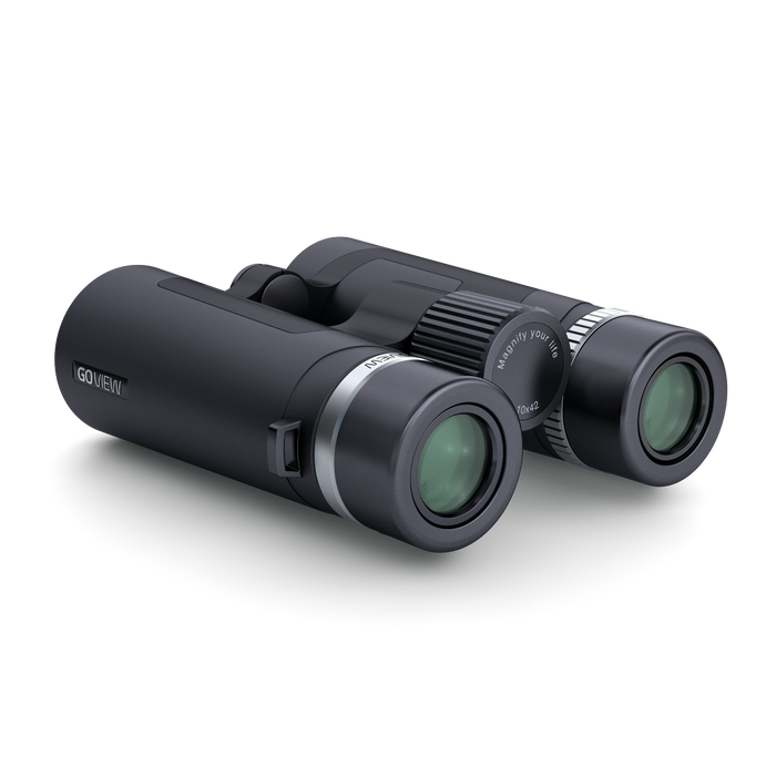 Black binoculars with green lenses on a white background