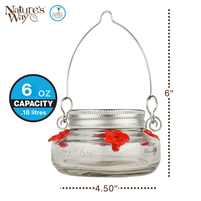 Glass jar with red flowers and metal hook, labeled 'Nature's Way' with capacity and size details.