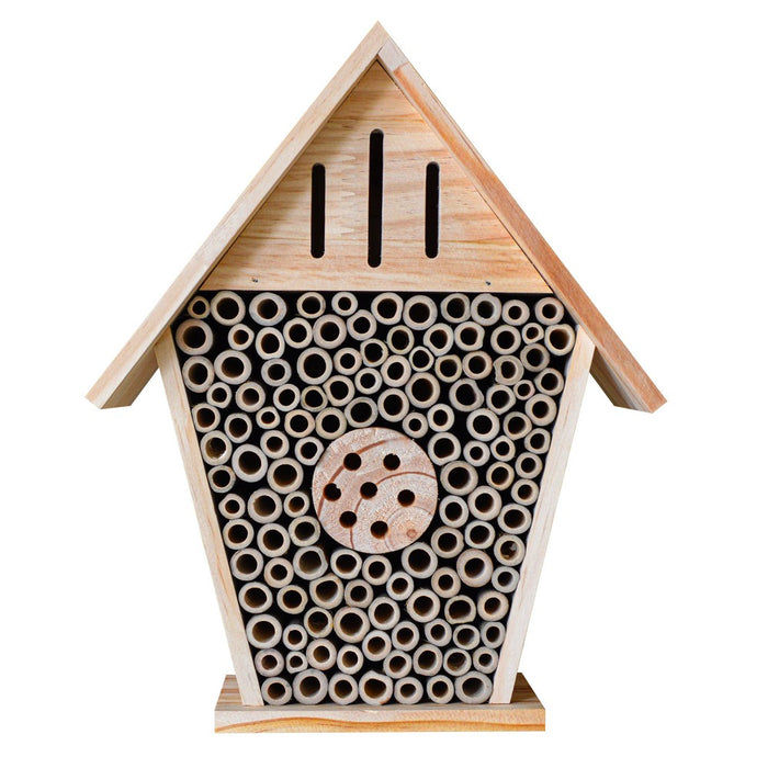 Wooden bee house with circular holes on a white background