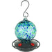 Colorful glass hummingbird feeder with a hook on a white background