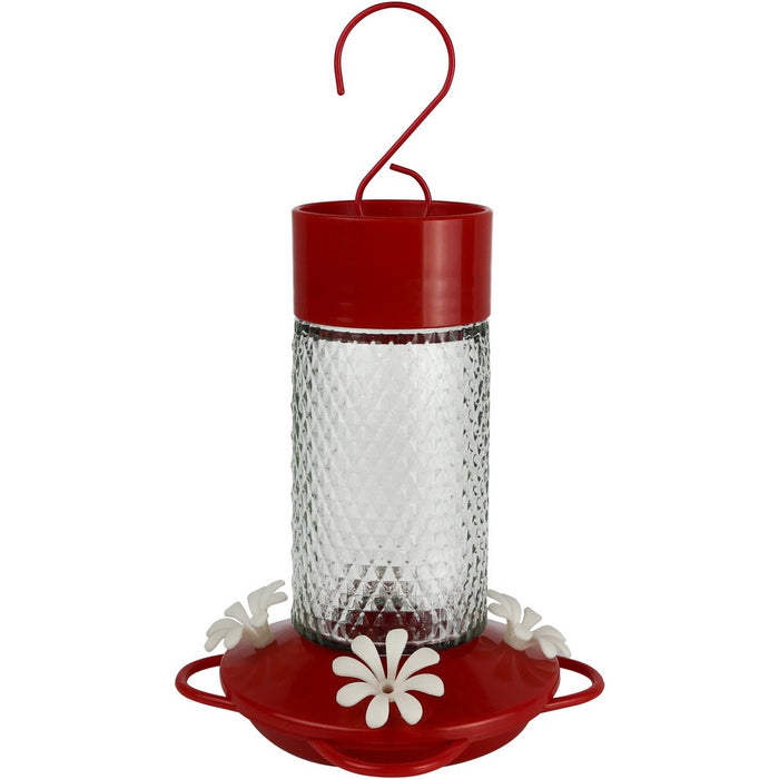 Red and clear hummingbird feeder on a white background