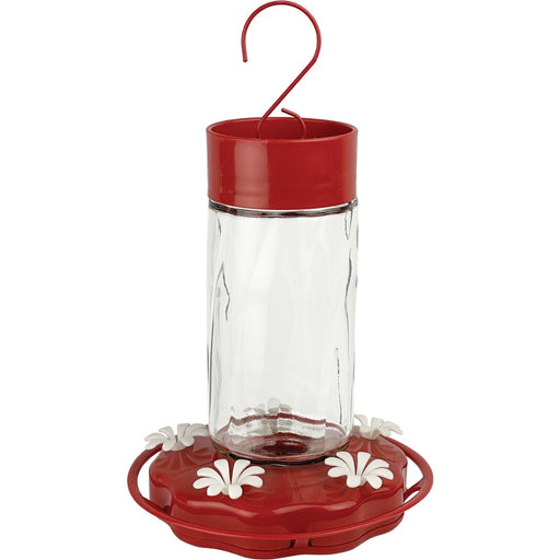Red and clear hummingbird feeder on a white background