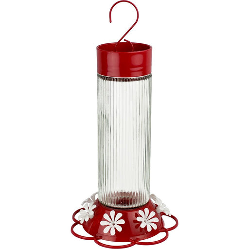 Red and clear hummingbird feeder with white flowers on a white background