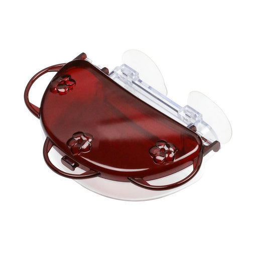Red and clear plastic object on a white background