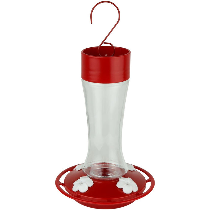 Hummingbird feeder with red top and base on a white background
