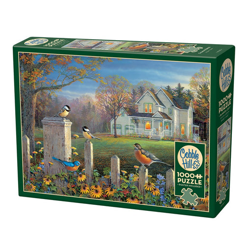 Cobble Hill Puzzle of a painting of a house with birds and flowers in a garden