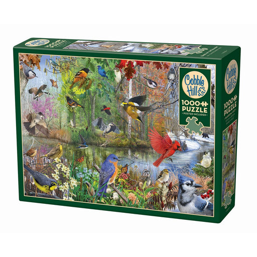 Jigsaw puzzle box featuring a colorful illustration of various birds in a natural setting, with 'Cobble Hill' branding.