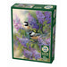 Jigsaw puzzle box featuring birds on a branch with purple flowers, brand 'Cobble Hill' visible.