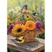Basket of flowers with colorful birds on a wooden surface