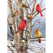 Birds perched on a tree in a snowy landscape