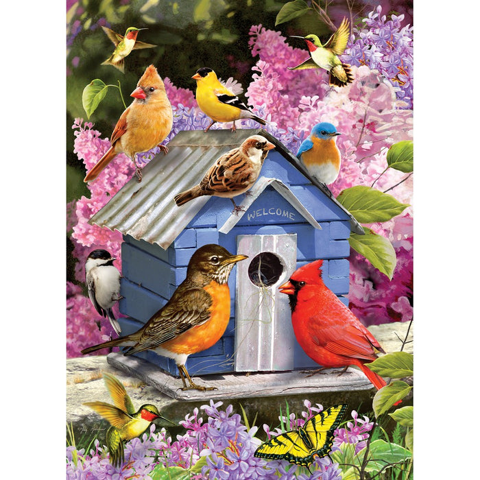 Puzzle of colorful birds around a blue birdhouse with flowers and butterflies in the background