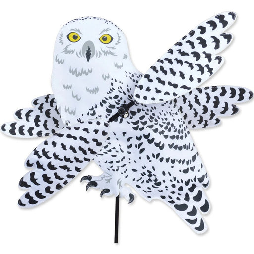 Decorative owl-shaped pinwheel with black and white pattern on a white background