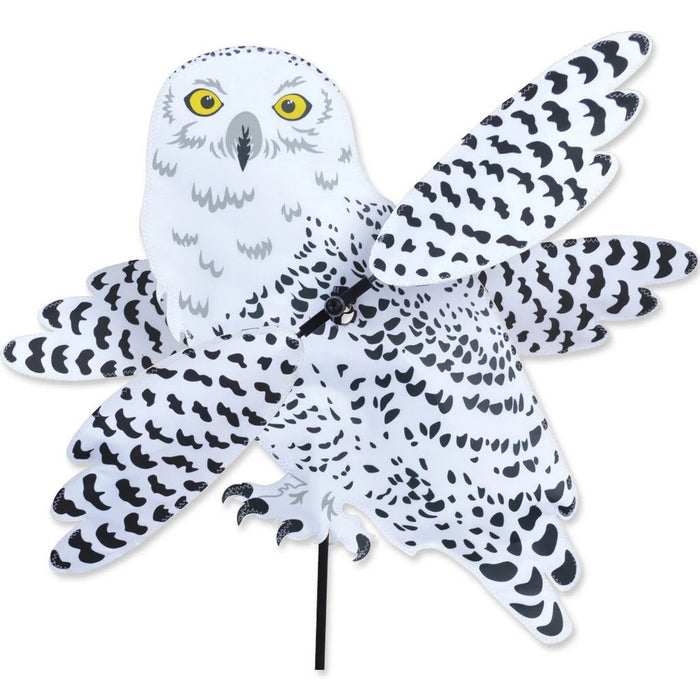 Decorative owl-shaped pinwheel with black and white pattern on a white background