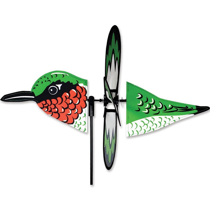 Colorful hummingbird-shaped wind spinner on a white background