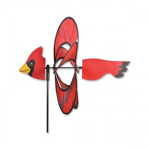 Red cardinal-shaped wind spinner on a white background