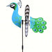 Colorful bird-shaped wind spinner with blue and green design on a white background