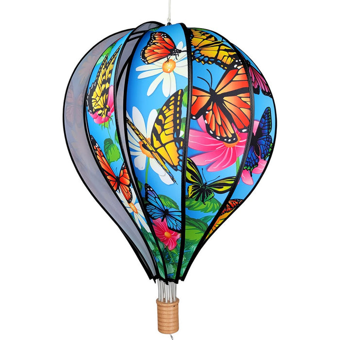 Decorative hot air balloon with colorful butterfly and flower design on a white background