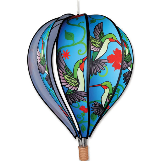 Decorative hot air balloon with colorful hummingbird design on a white background