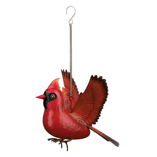 Red cardinal bird ornament hanging on a white background