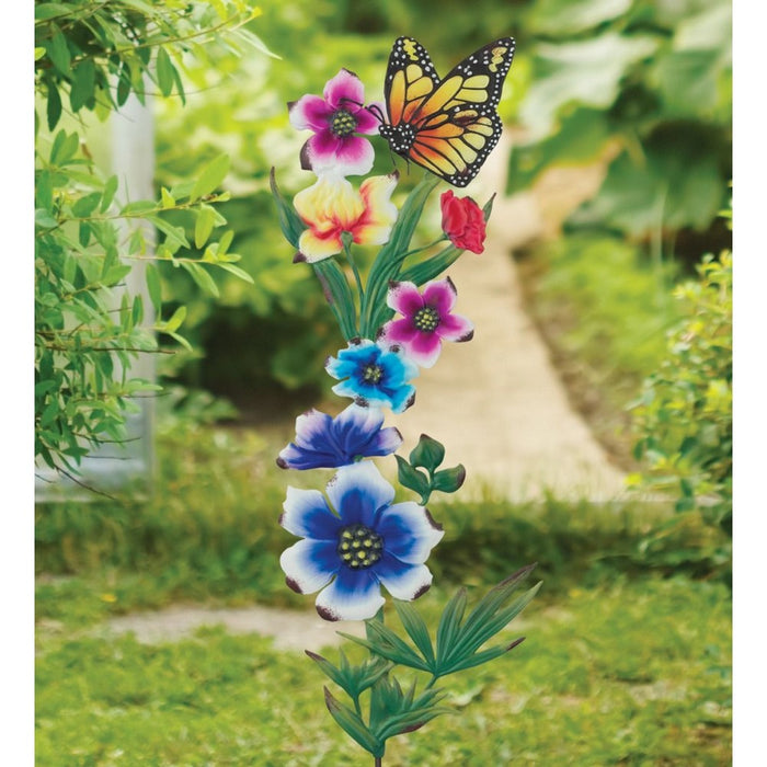 Decorative garden stake with flowers and a butterfly on a green background