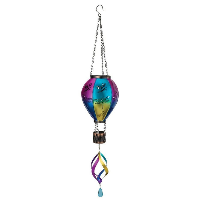 Colorful hanging wind chime with dragonfly design on a white background