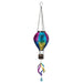 Colorful hanging wind chime with dragonfly design on a white background