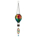Colorful hanging glass ornament with a bird design on a white background