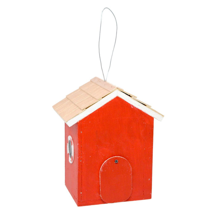 Red birdhouse with a wooden roof on a white background
