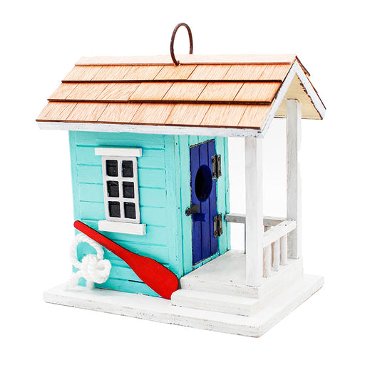 Decorative birdhouse with a blue door, red paddle, and white base on a white background