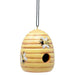 Wooden bee house with painted bees on a white background