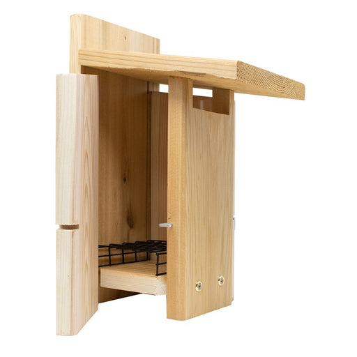 Wooden birdhouse with a white background