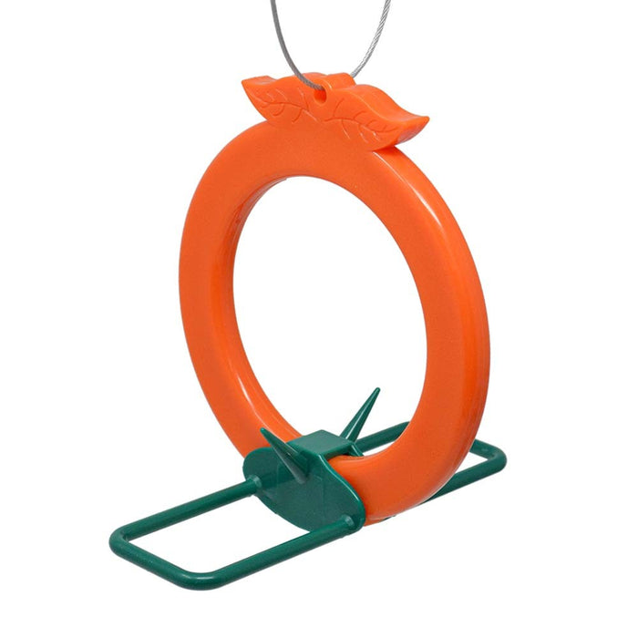 Orange bird feeder with green stand on a white background