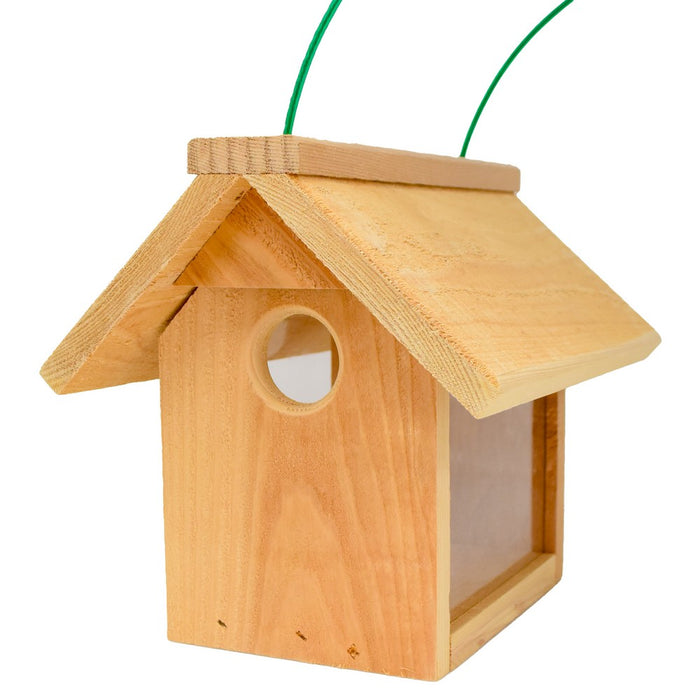 Wooden birdhouse with a green string on a white background