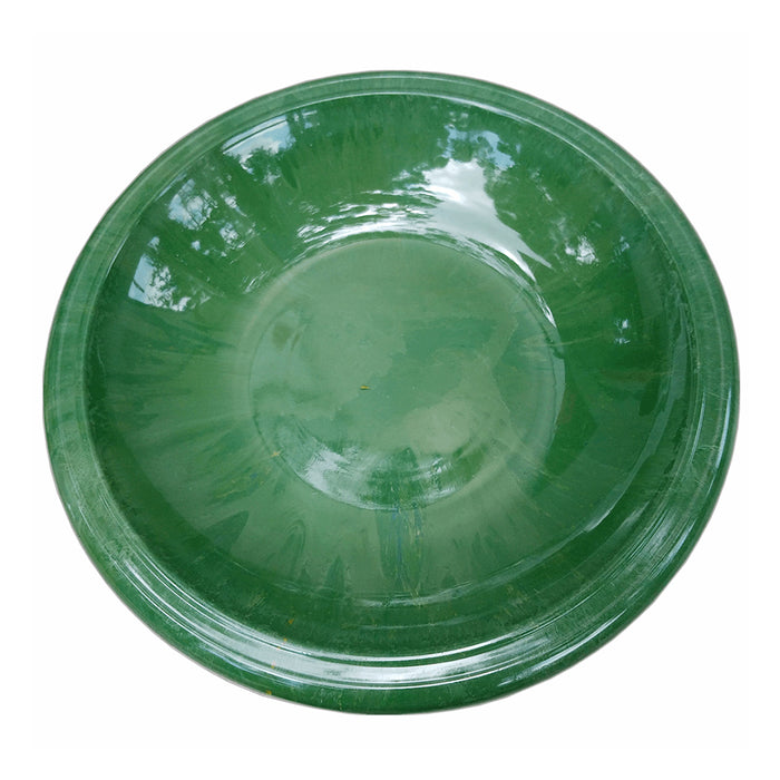 Green plastic bowl on a white background