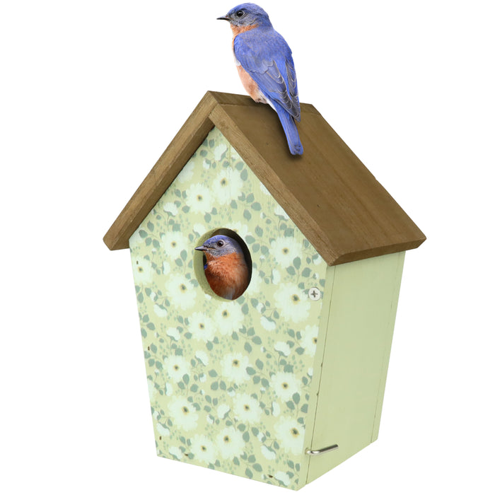 Birdhouse with floral pattern and bluebird on top, on a white background