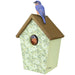 Birdhouse with floral pattern and bluebird on top, on a white background