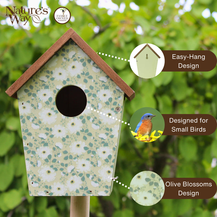 Decorative birdhouse with floral pattern on a green background, featuring 'Nature's Way' branding.