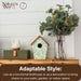 Decorative birdhouse, bird figurine, and vase with greenery on a wooden surface with 'Nature's Way' branding.
