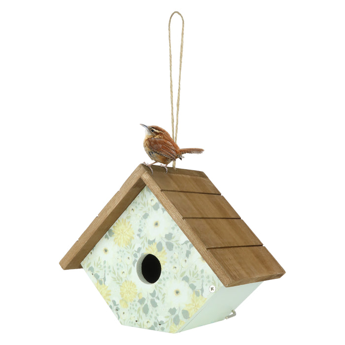 Birdhouse with a bird perched on top against a white background
