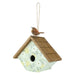 Birdhouse with a bird perched on top against a white background