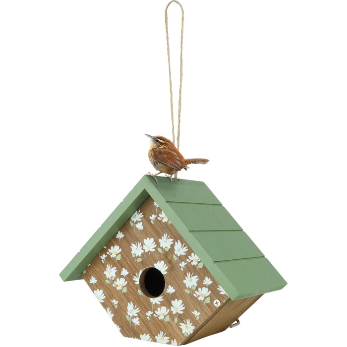 Birdhouse with floral pattern and green roof on a white background